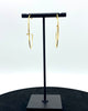 Geometric hoop design earrins made in 14k karat gold.