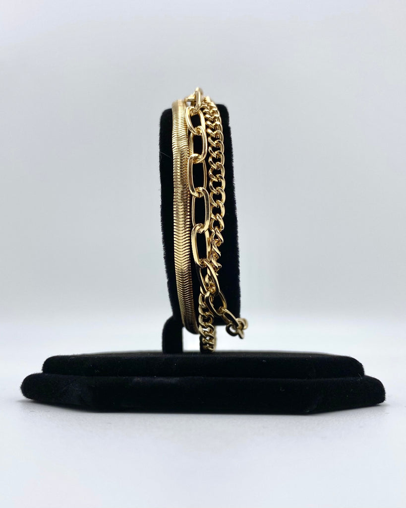 Layered toggle bracelet made in stainless steel and karat gold dipped.