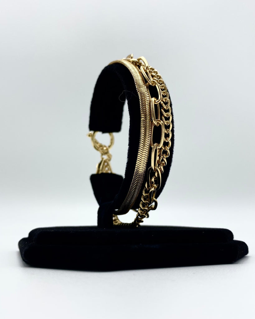 Layered toggle bracelet made in stainless steel and karat gold dipped.